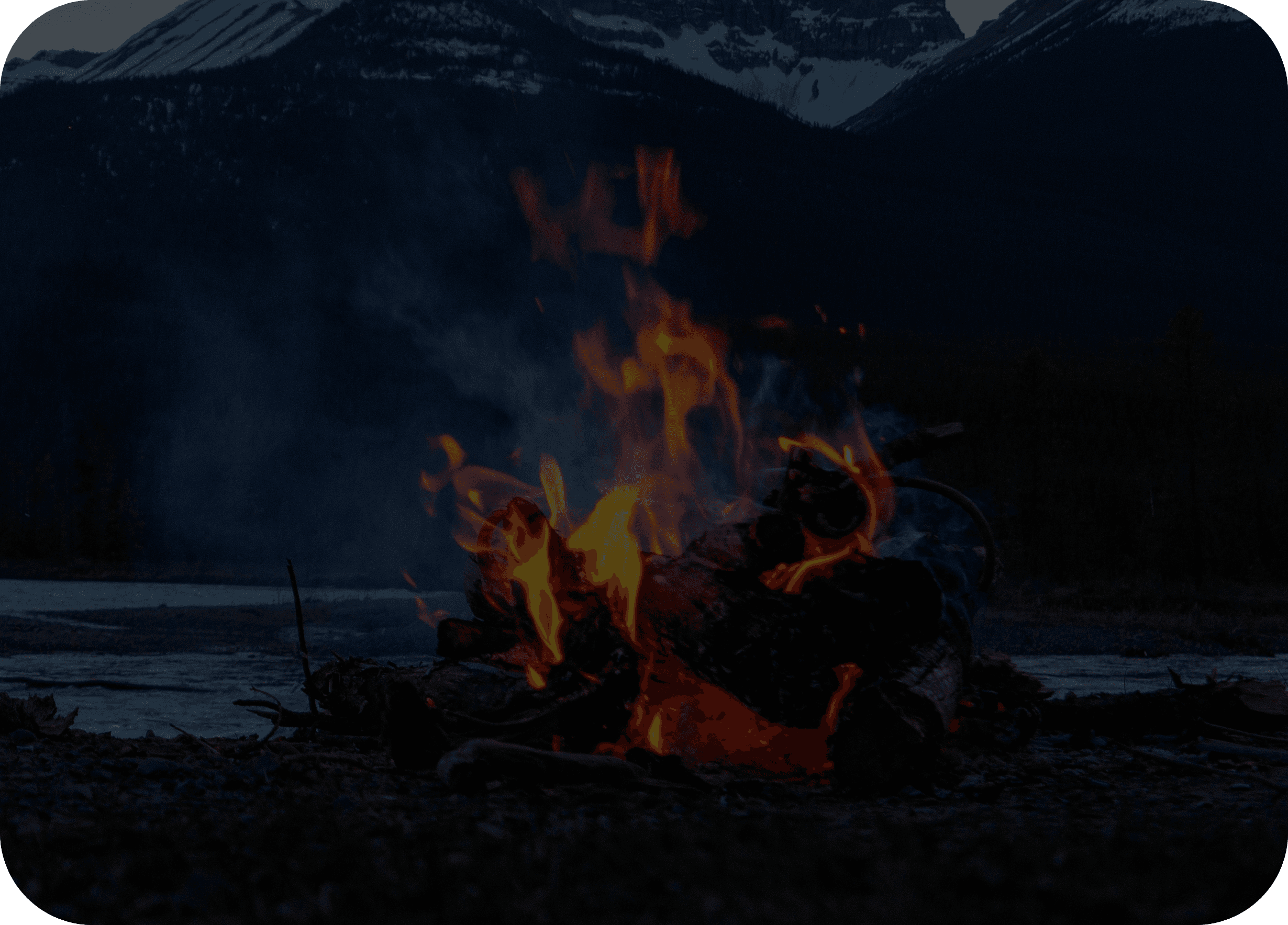 Firepit in the wild with mountains in the background